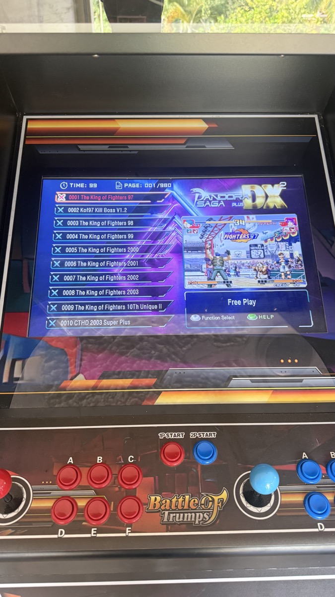 Arcade screen showing the multi-game selection menu and two-player controls