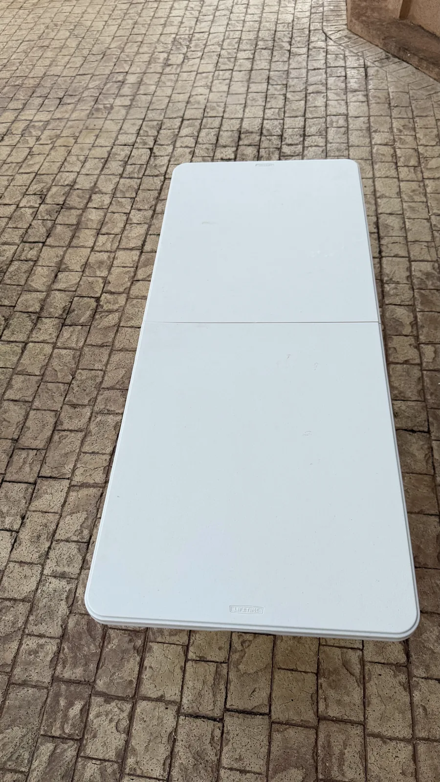 White six-foot folding table available from Weekendaz