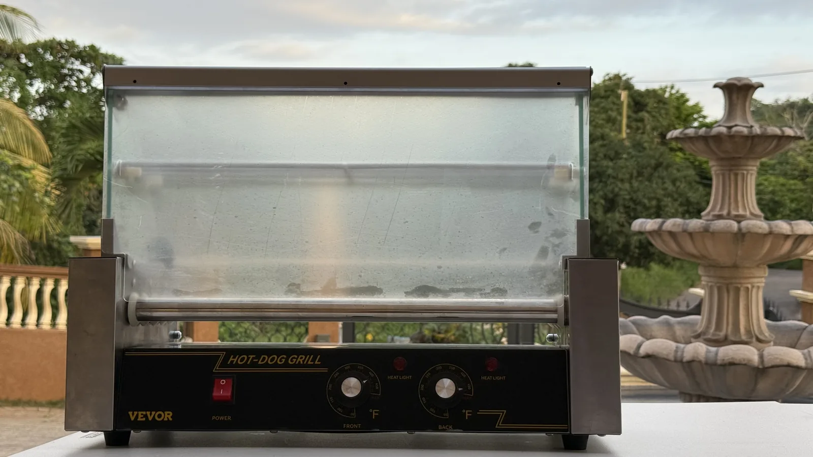 Wide front view of the Weekendaz stainless-steel hot-dog roller grill