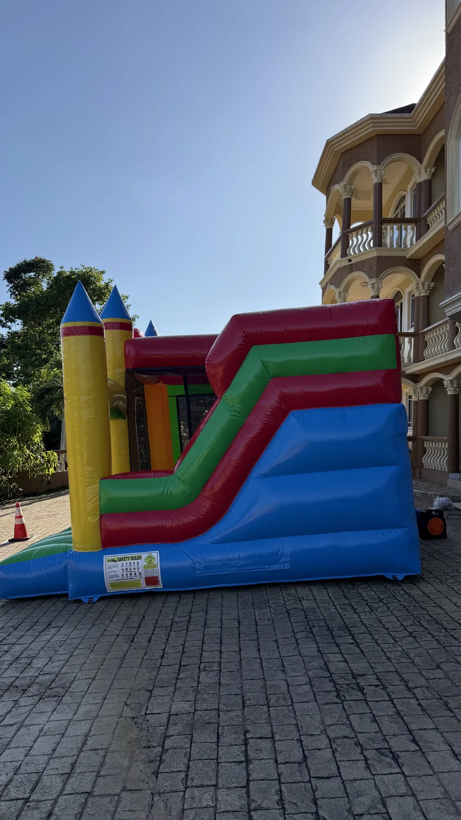 Side profile of the climbing lane and slide on the 15 by 15 foot bouncer
