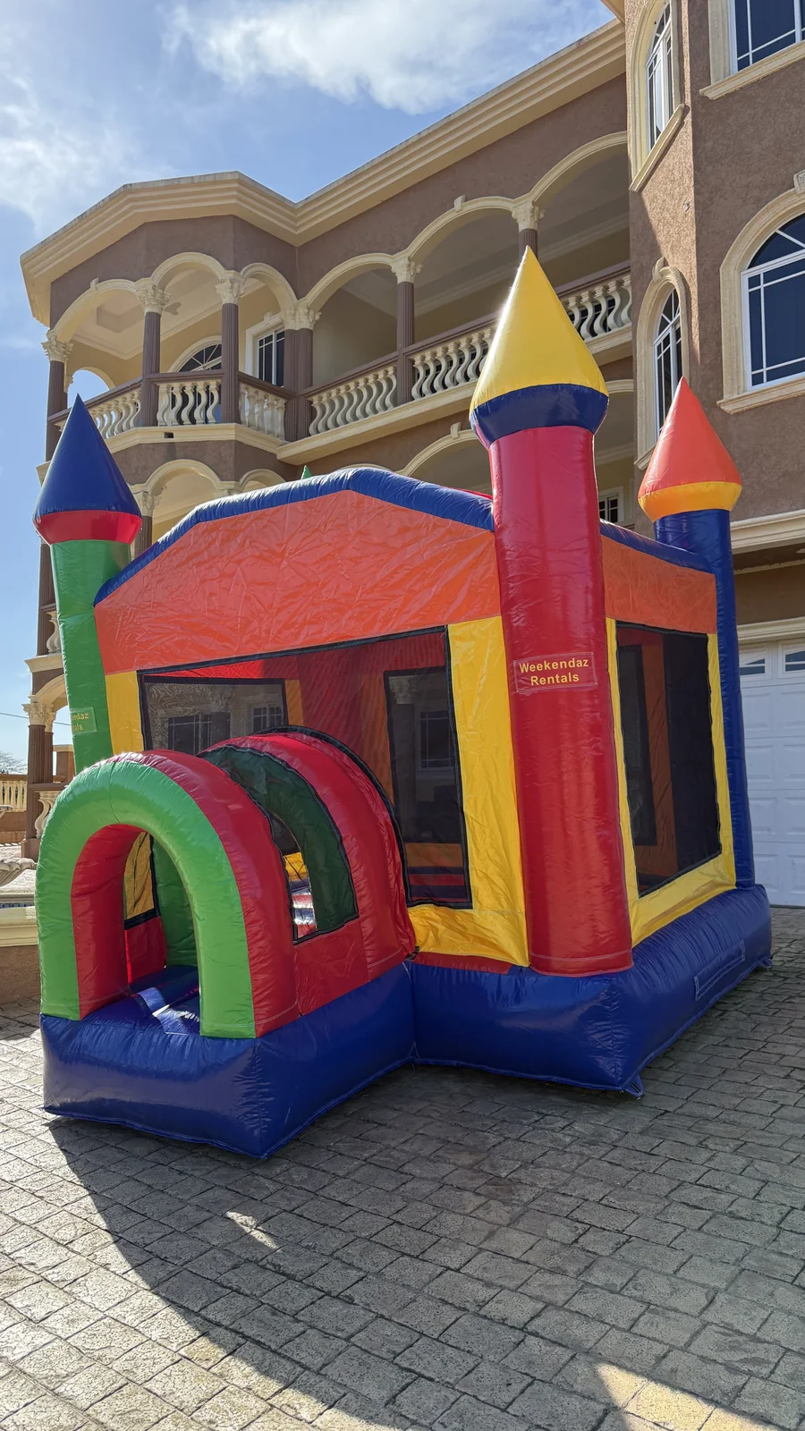 Side entrance and safety netting on the 12 by 12 foot castle bouncer