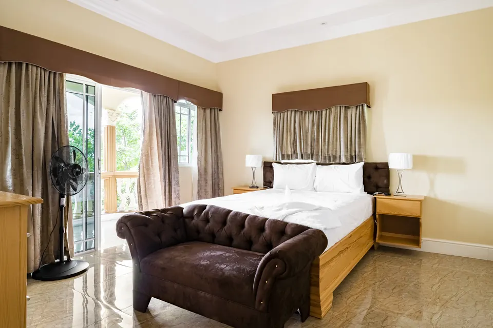 Room 6 ( first of the five rooms on the second floor). This room consists of an AC unit, a standing fan, a patio and a 42" Samsung Smart tv. This room shares a bathroom with Room 7.