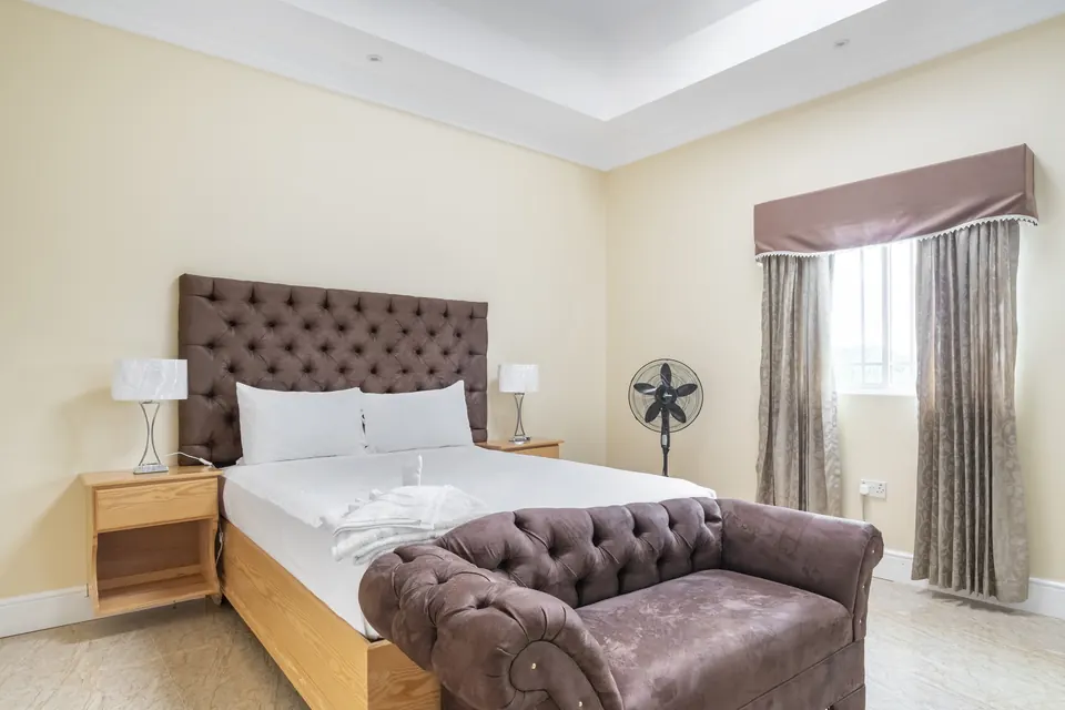 Room 7 ( Second of the five rooms on the second floor). This room consists of an AC unit, a standing fan and a 42" Samsung Smart tv. This room shares a bathroom with Room 6.