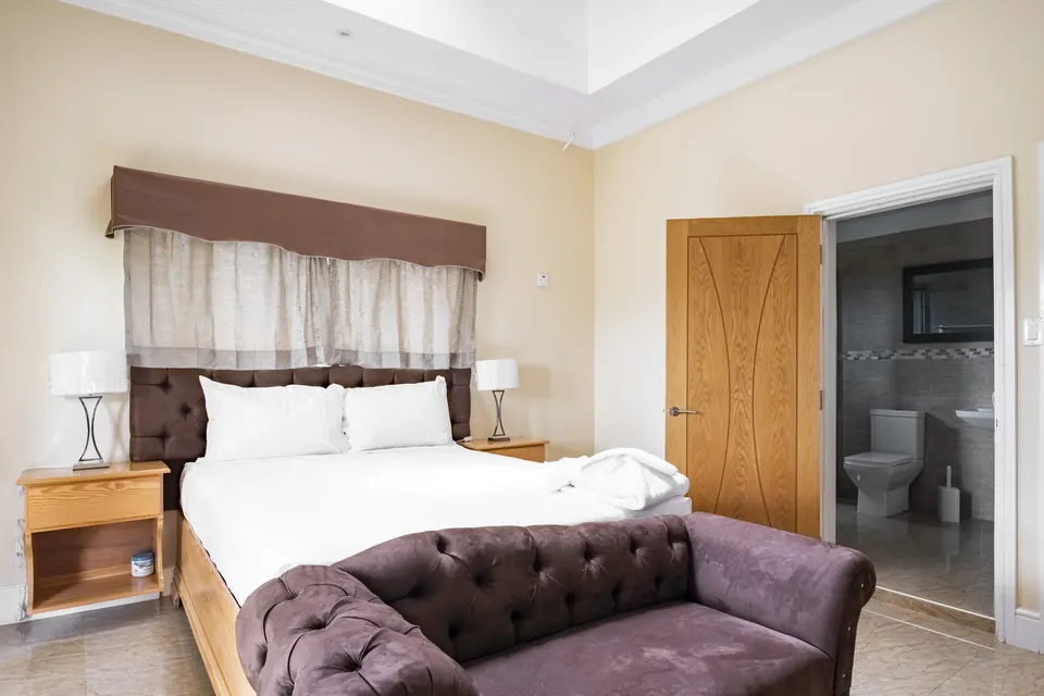 Room 8 ( Third of the five rooms on the second floor). This room consists of a standing fan, a 42" Samsung Smart tv, a patio as well as an en suite bathroom.