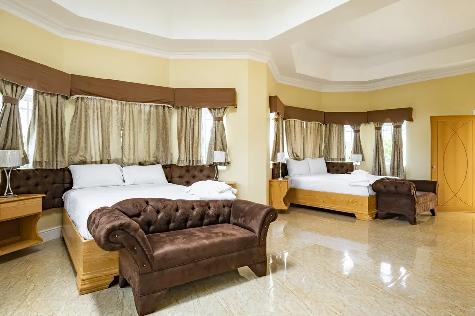 Room 9 ( Fourth of the 5 rooms on the second floor). This room consists of two ceiling fans along with an AC Unit, a 42" Samsung Smart tv, a patio, an en suite bathroom with a jacuzzi.