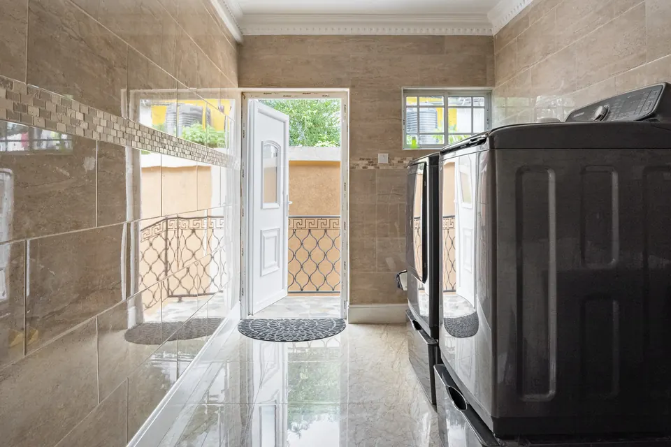 The Laundry Room which consists of a wash tub, a washer and dryer